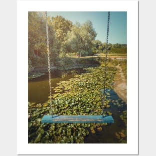 swing hanging over a waterlilies pond Posters and Art